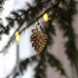 Fyrrekogle, 18 karat guldbelagt